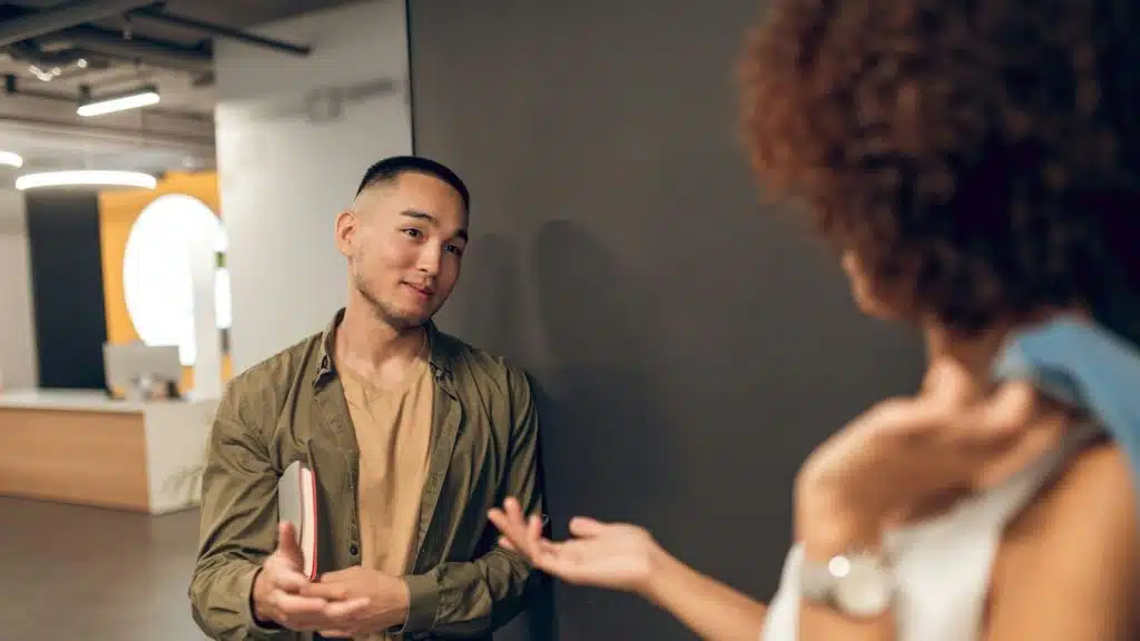 A man talking to a woman