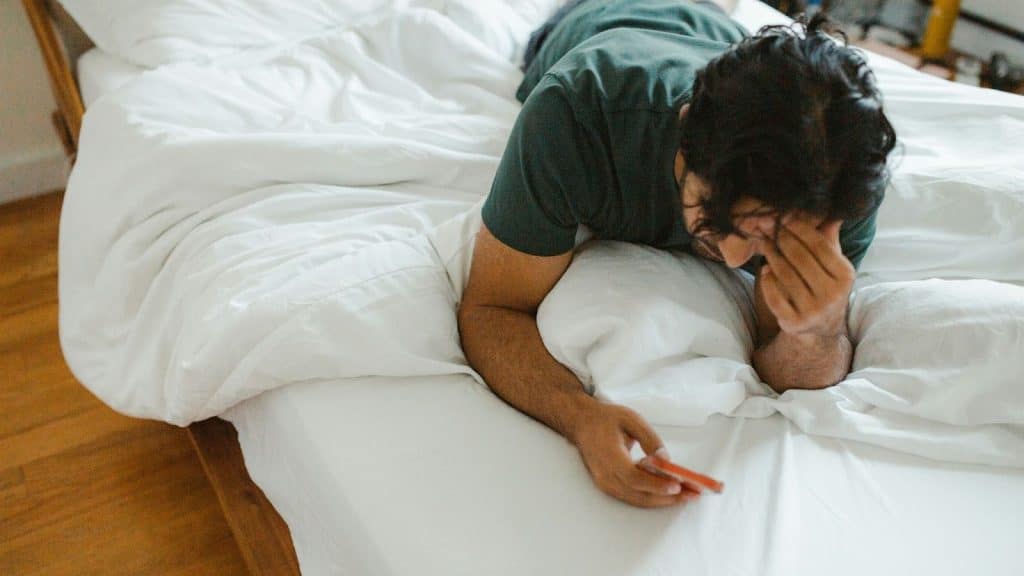 A man alone and using his phone 