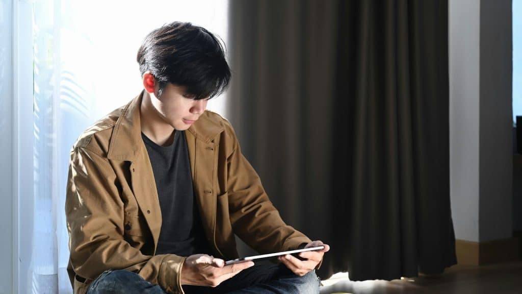 A man looking at the pictures of his ex