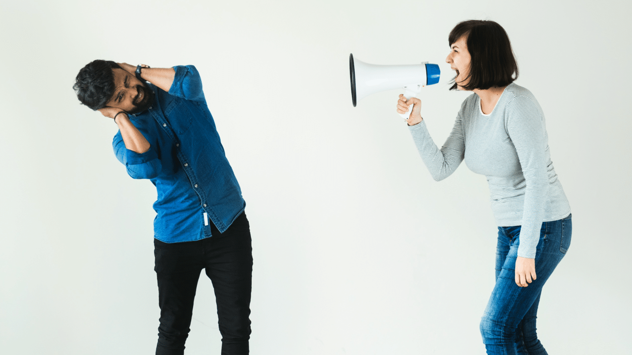 A woman shouting through a megaphone