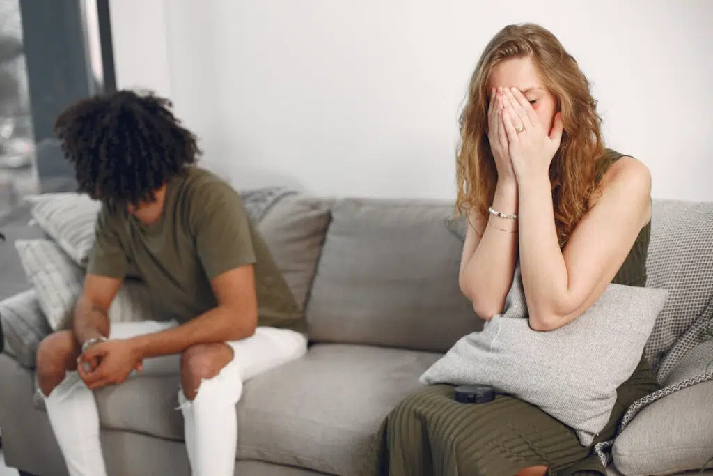 A Distant Couple Sitting on a Sofa