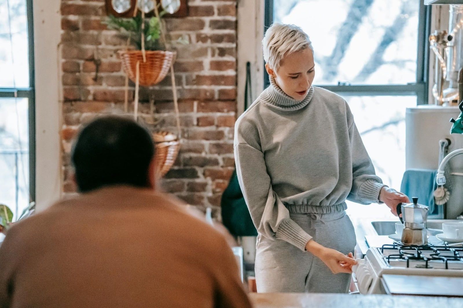 A woman making coffee for her husband