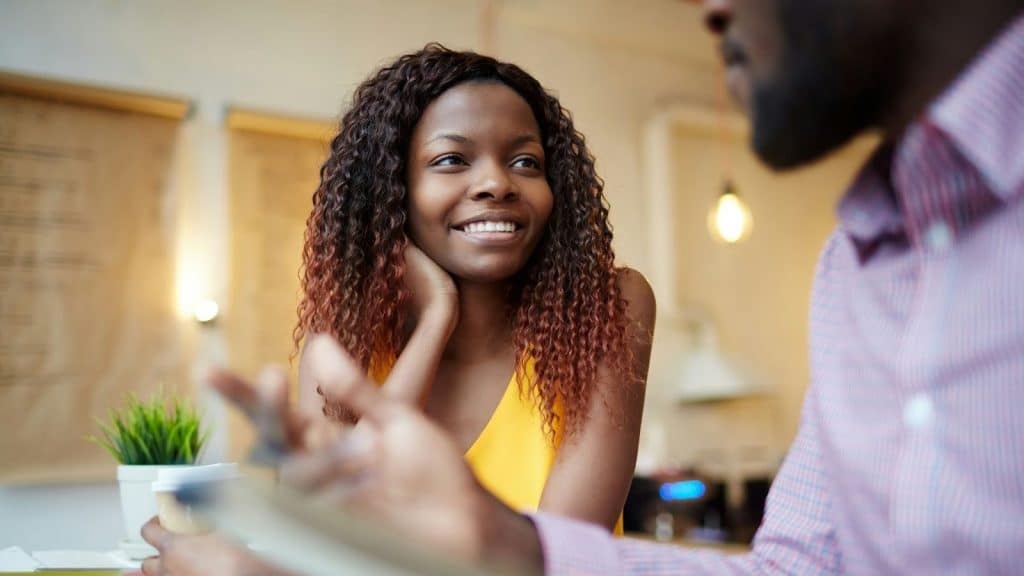 Woman smiling to a man