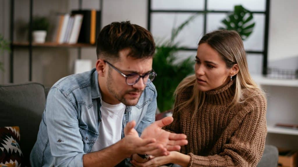 A man and woman having a serious conversation