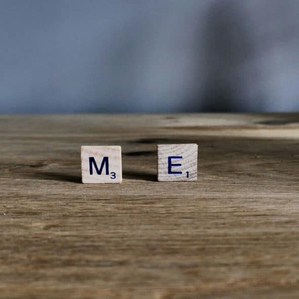 Scrabble letters spelling out “me”