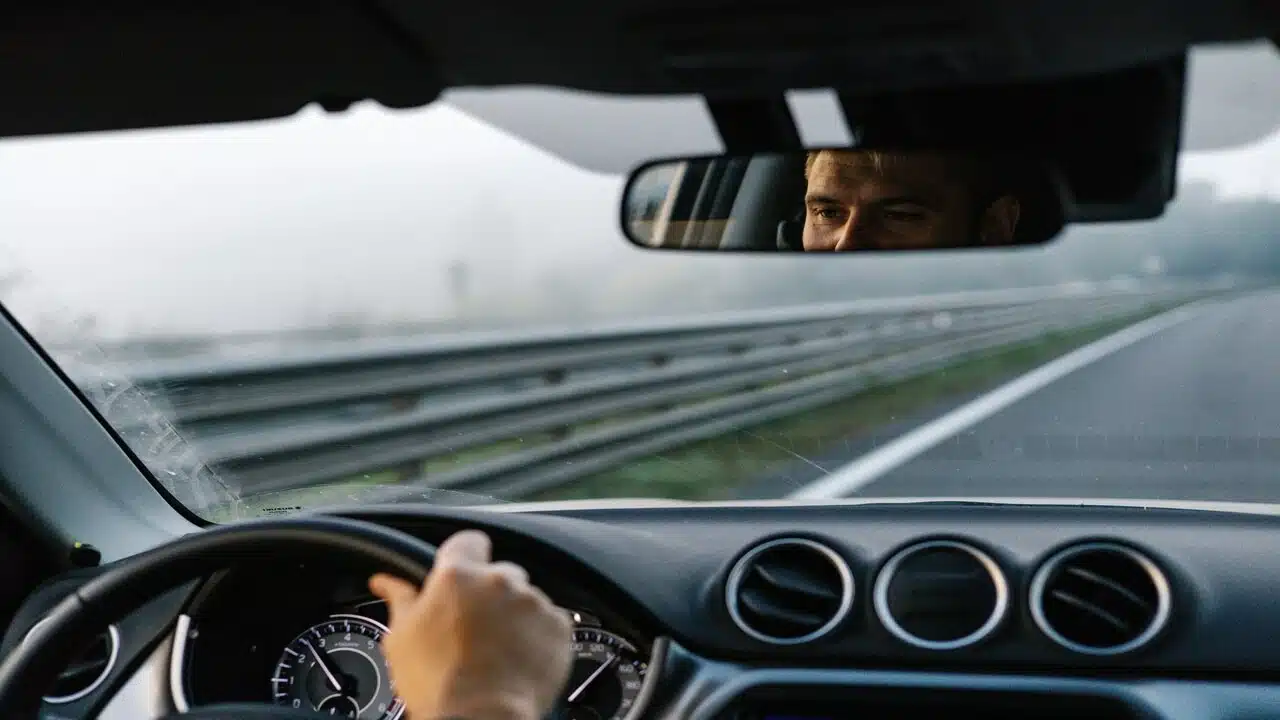 A man driving on a highway