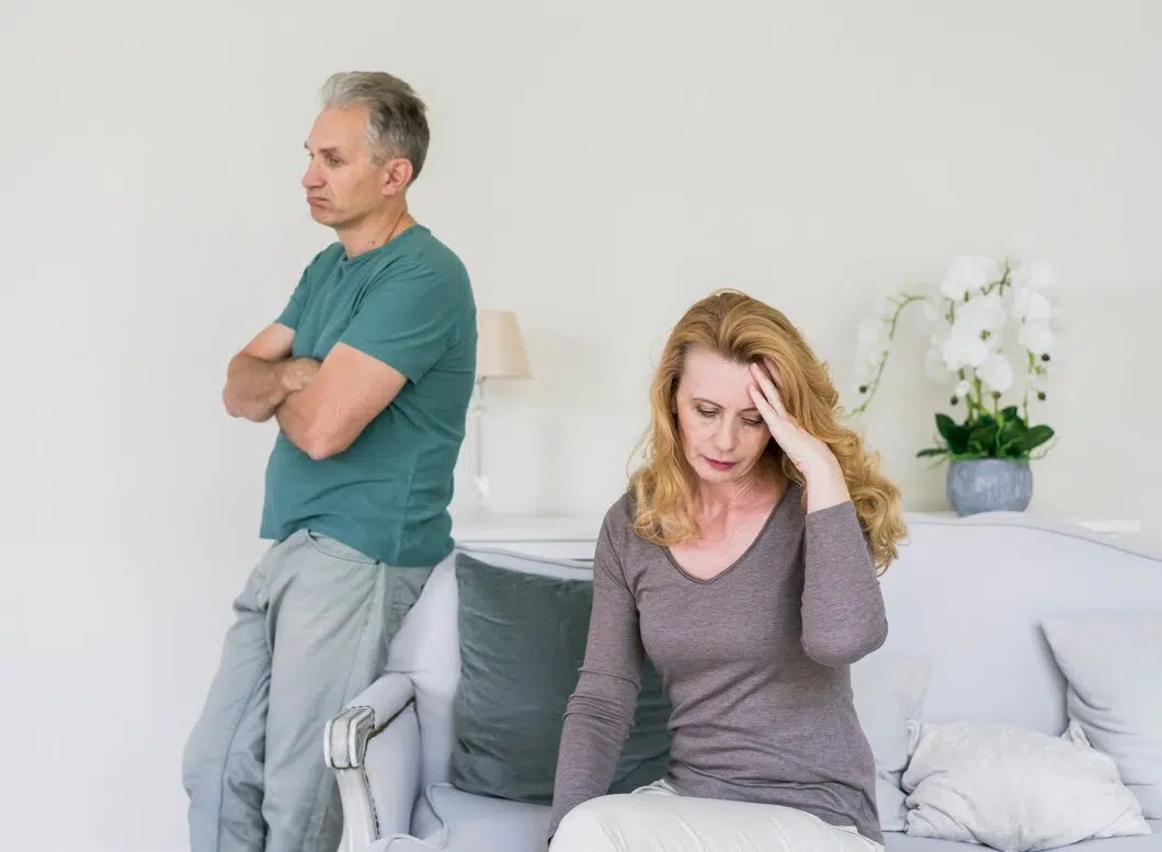 Senior couple worried indoors