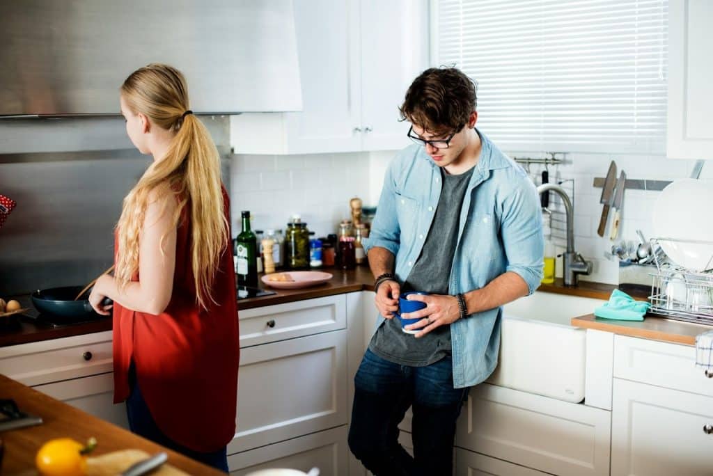 couple disagreement kitchen