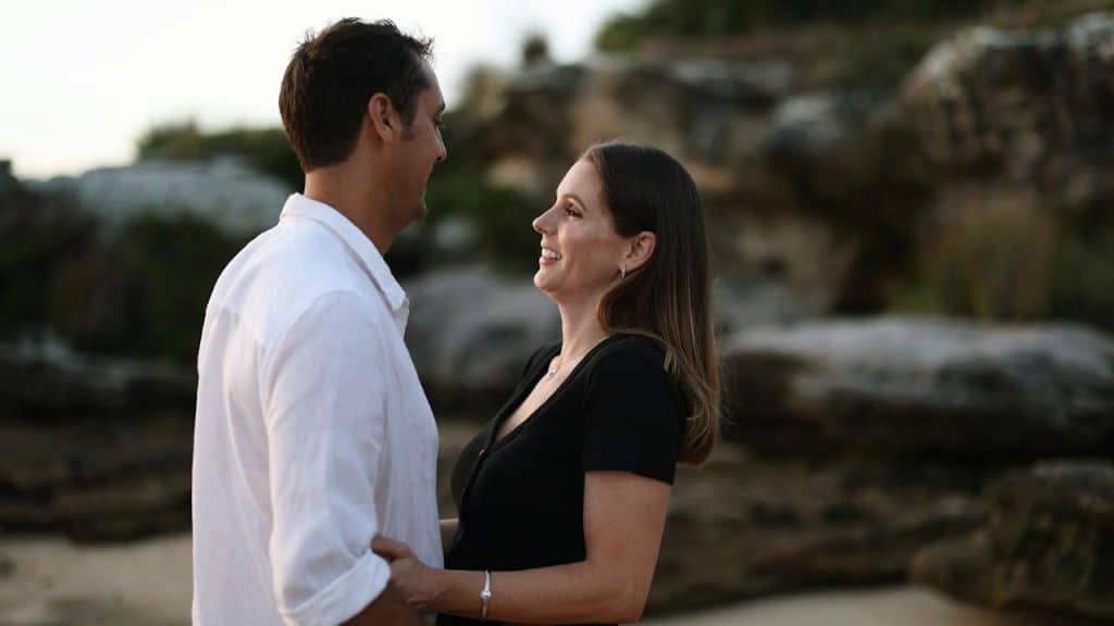 A man and a woman standing next to each other.