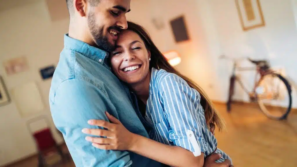 Beautiful couple hugging and looking at each other.