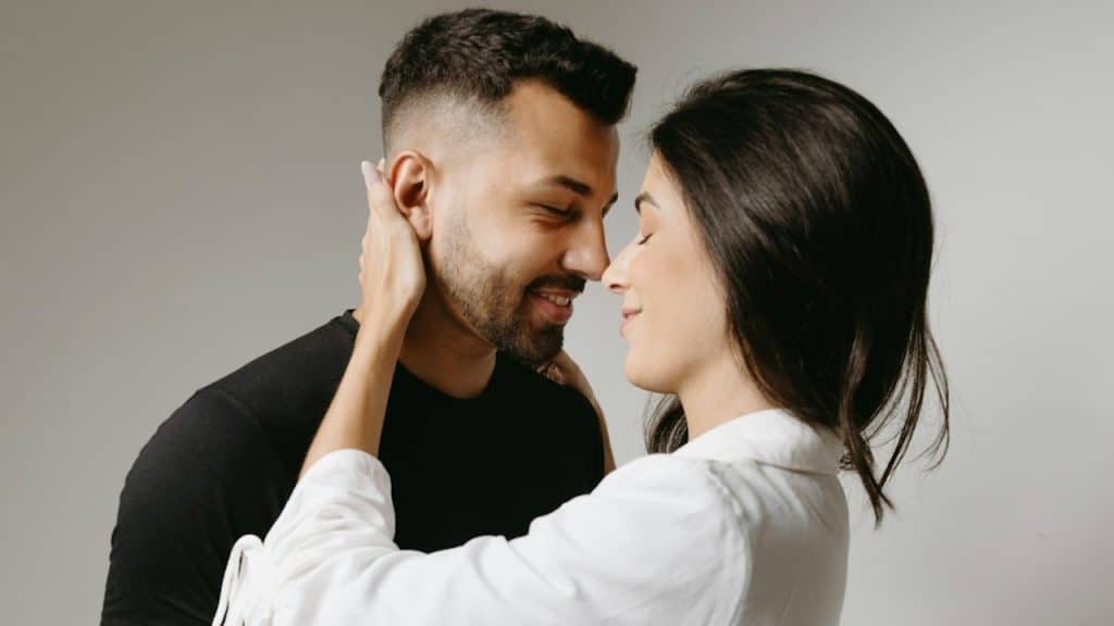 A man and a woman embracing each other.