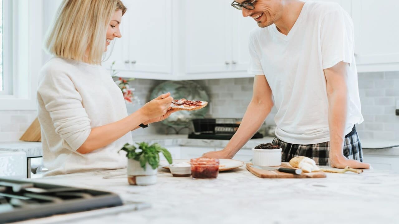A woman making her husband a toast