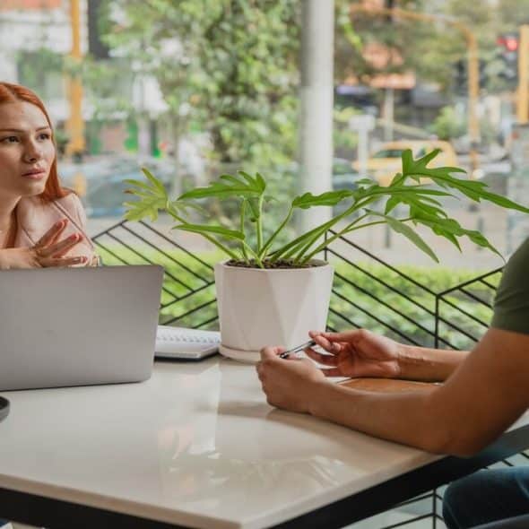 A couple talking at a cafe
