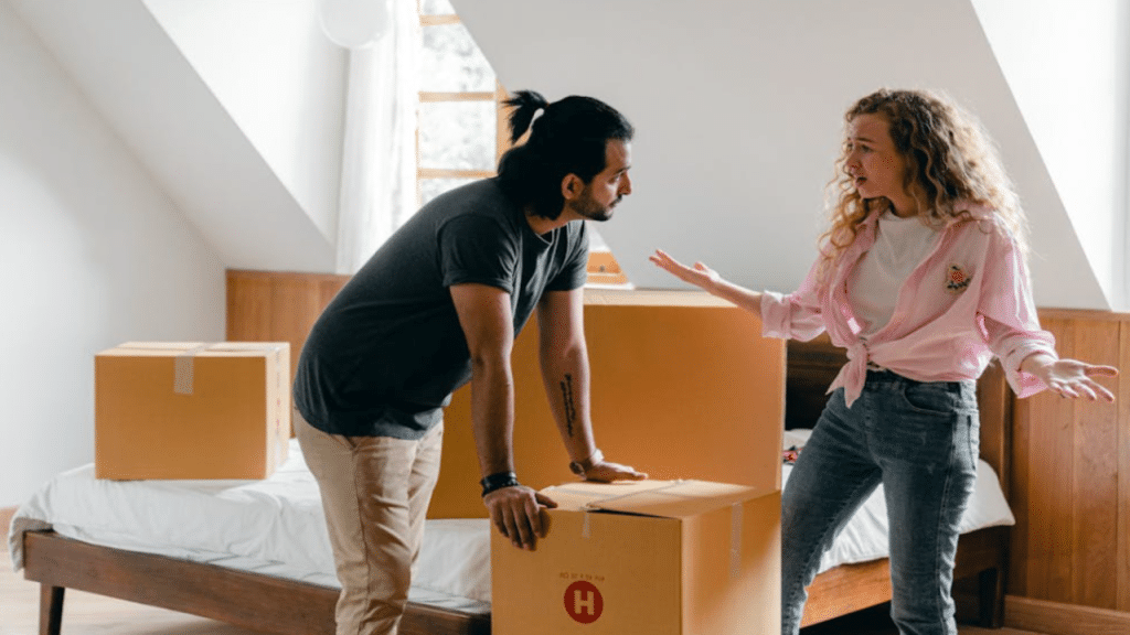 A couple arguing while moving