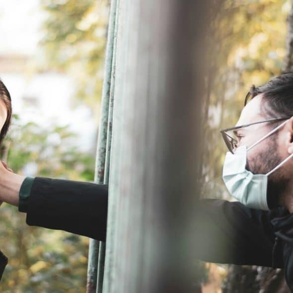 A man touching his wife’s face