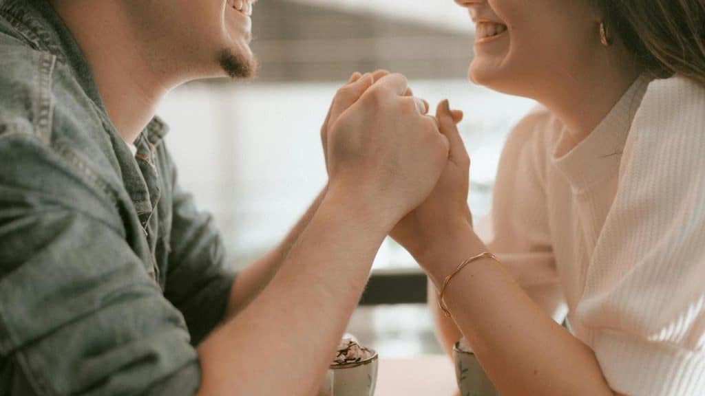A couple smiles at each other