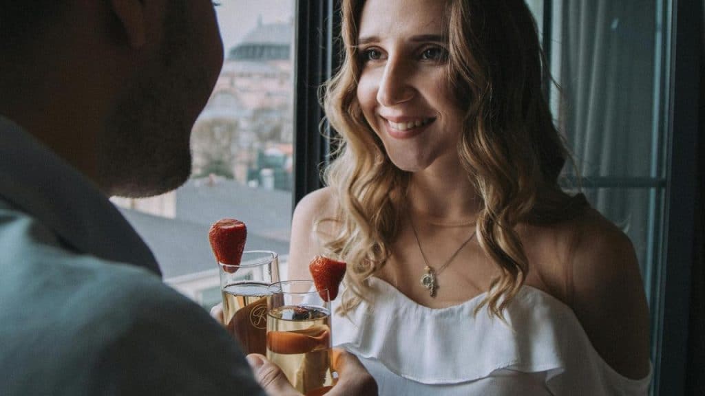 A couple smiles at each other