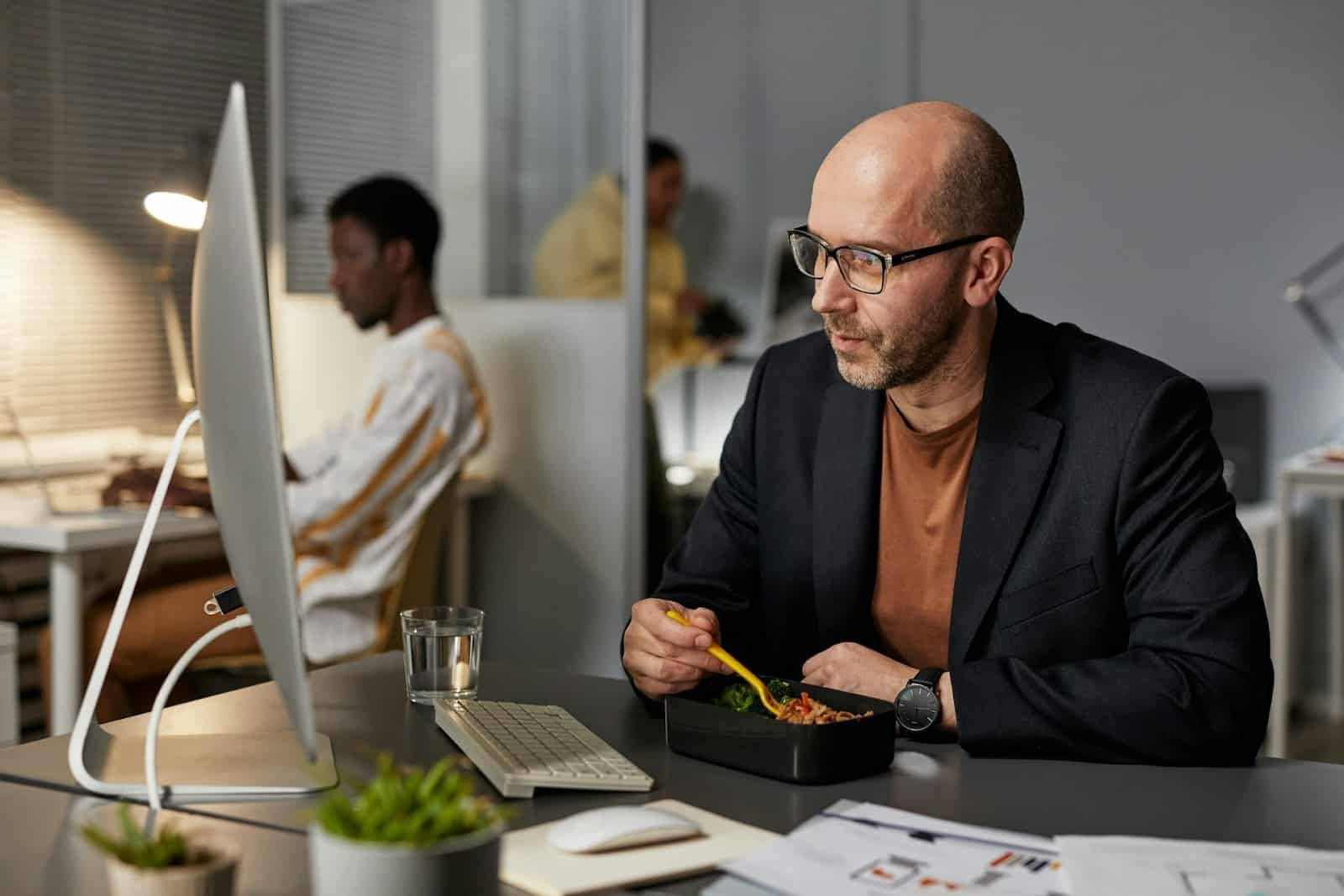 man snacking at work