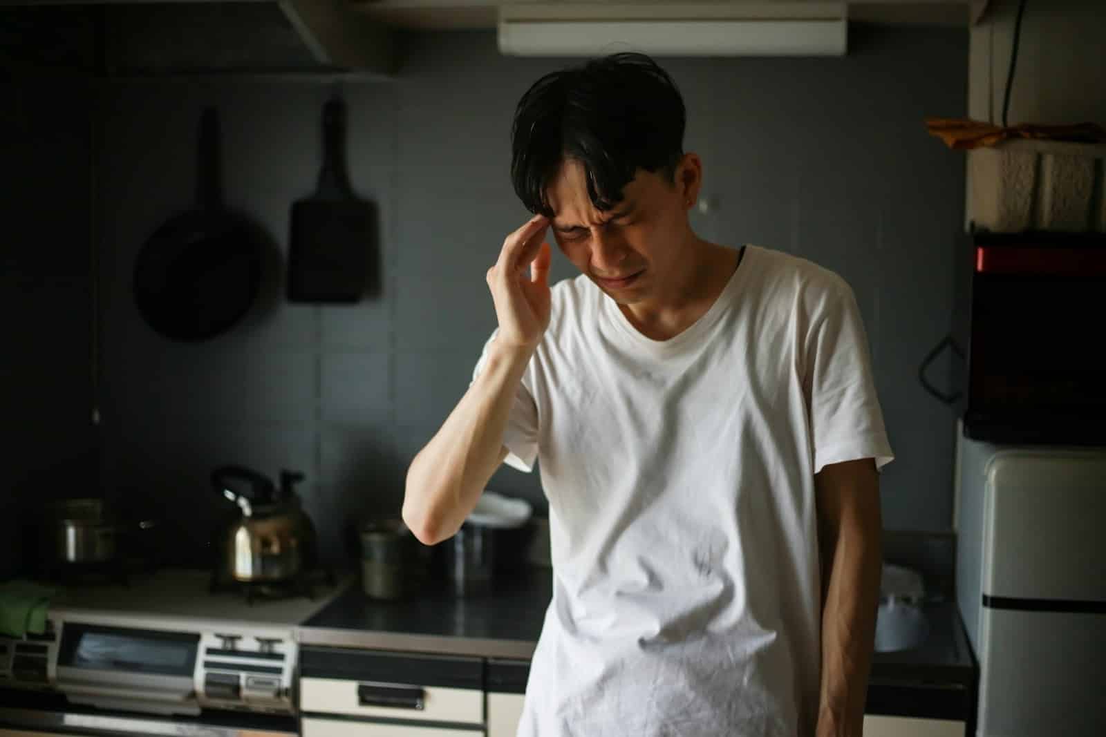 tired man kitchen