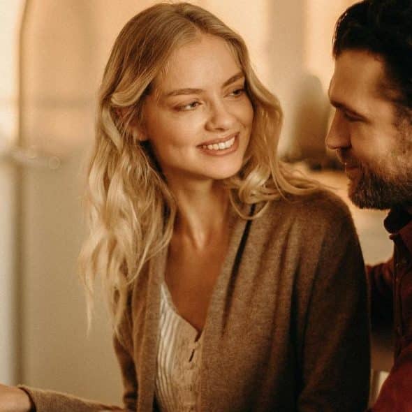 A couple smiling at each other