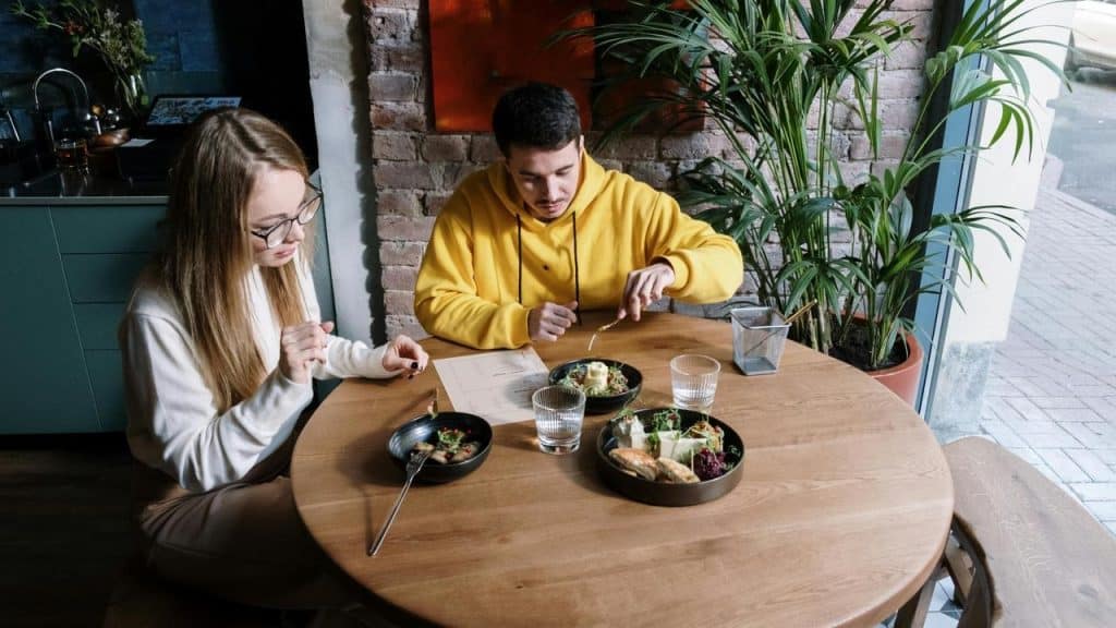 A man and woman eating together