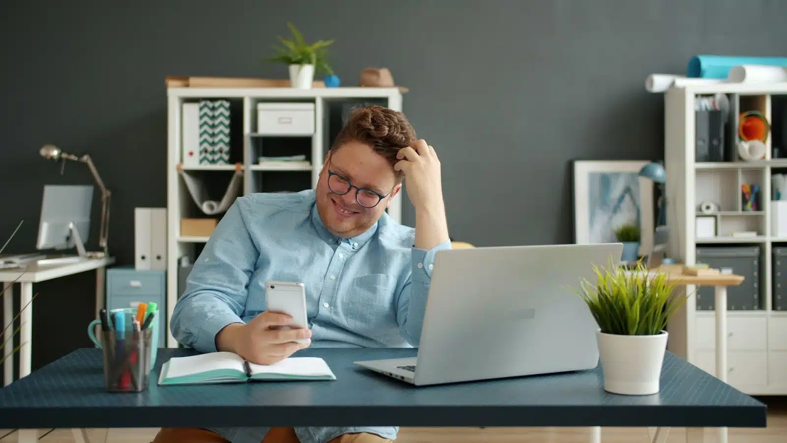 man distracted workspace