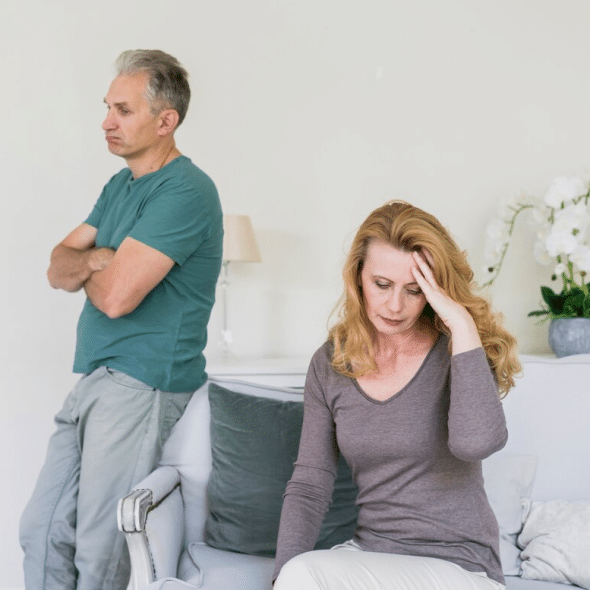 Senior couple worried indoors