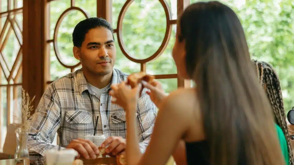 A man and woman sitting at a table