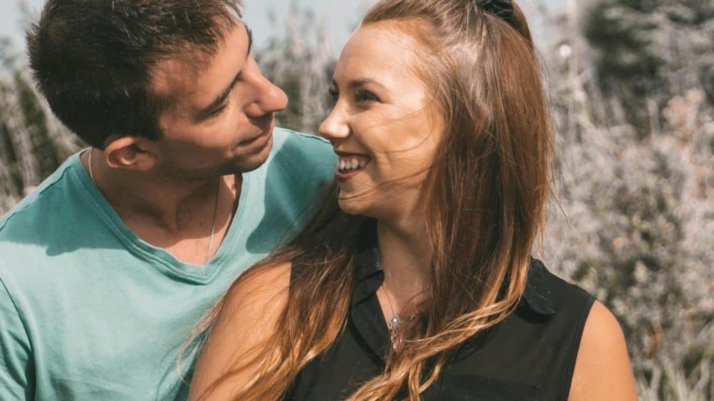 A couple smiling at each other