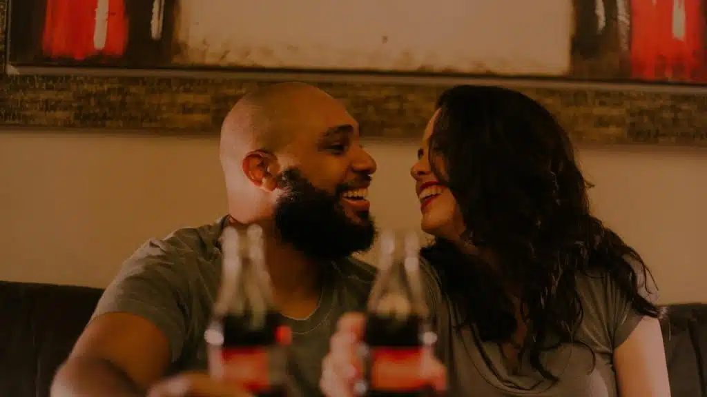 A smiling couple sitting close together