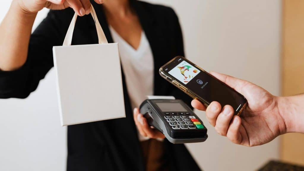 A customer paying with a smartphone