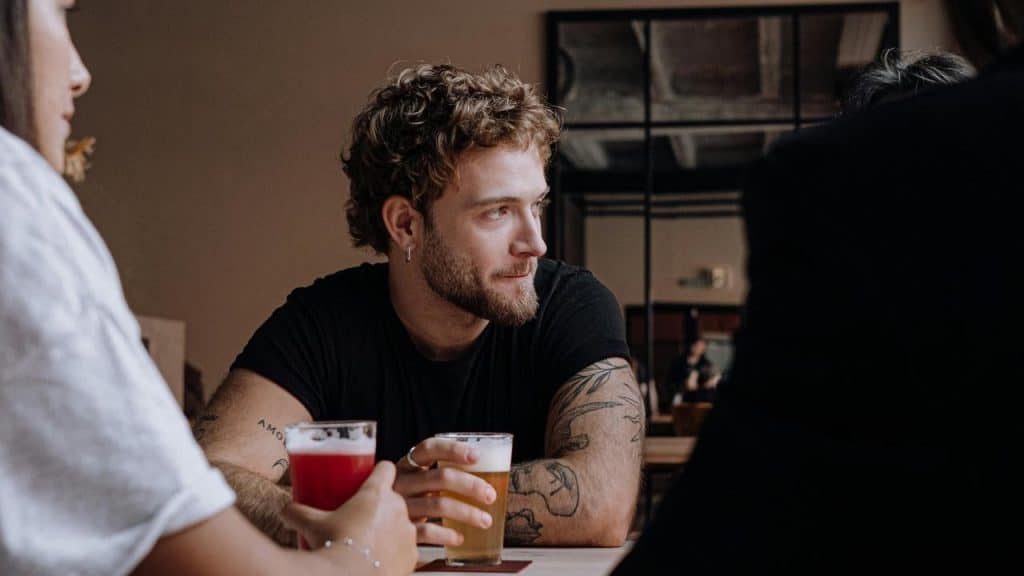 A man holding a beer