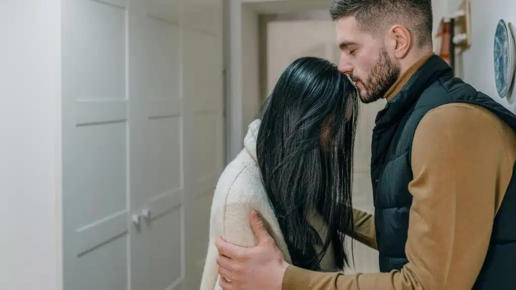 A man comforting a woman