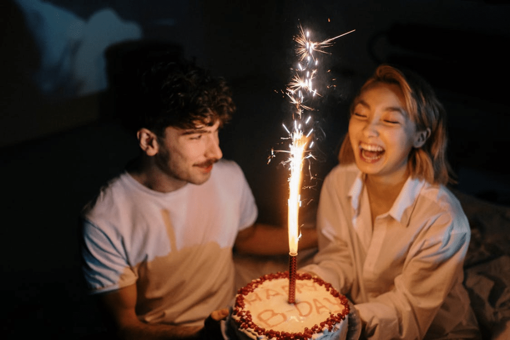 Couple Holding a Birthday Cake