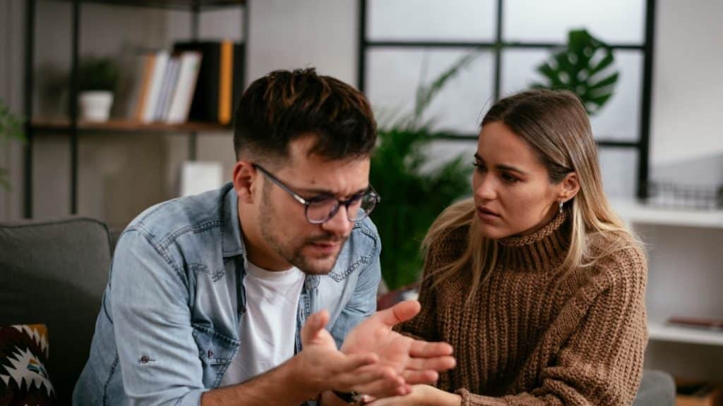 A man and woman having a serious conversation
