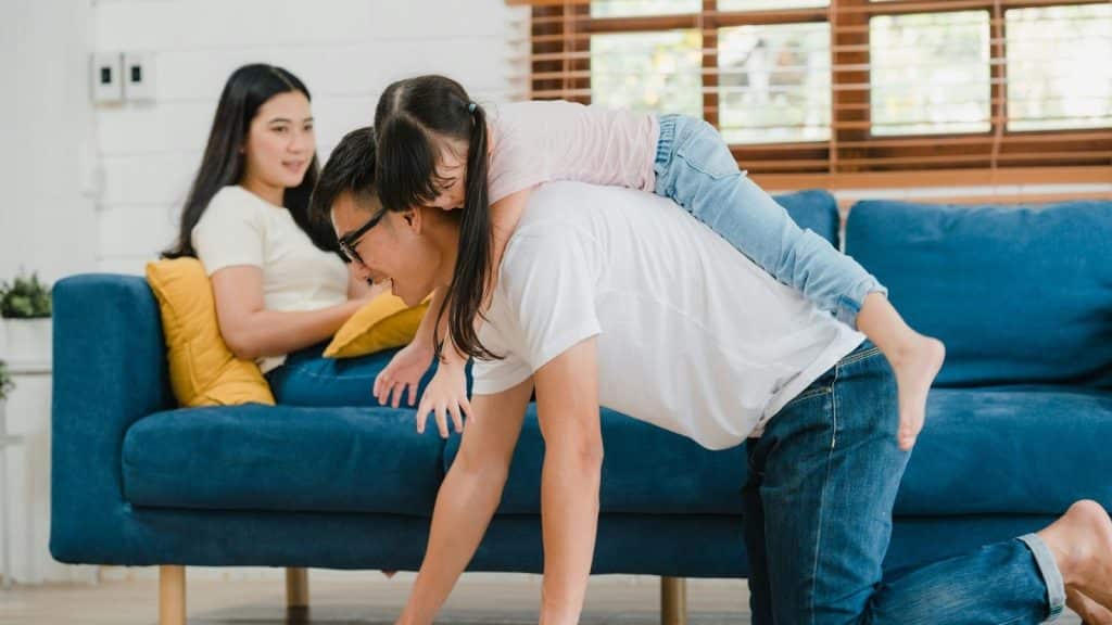 Woman not playing with her daughter and husband