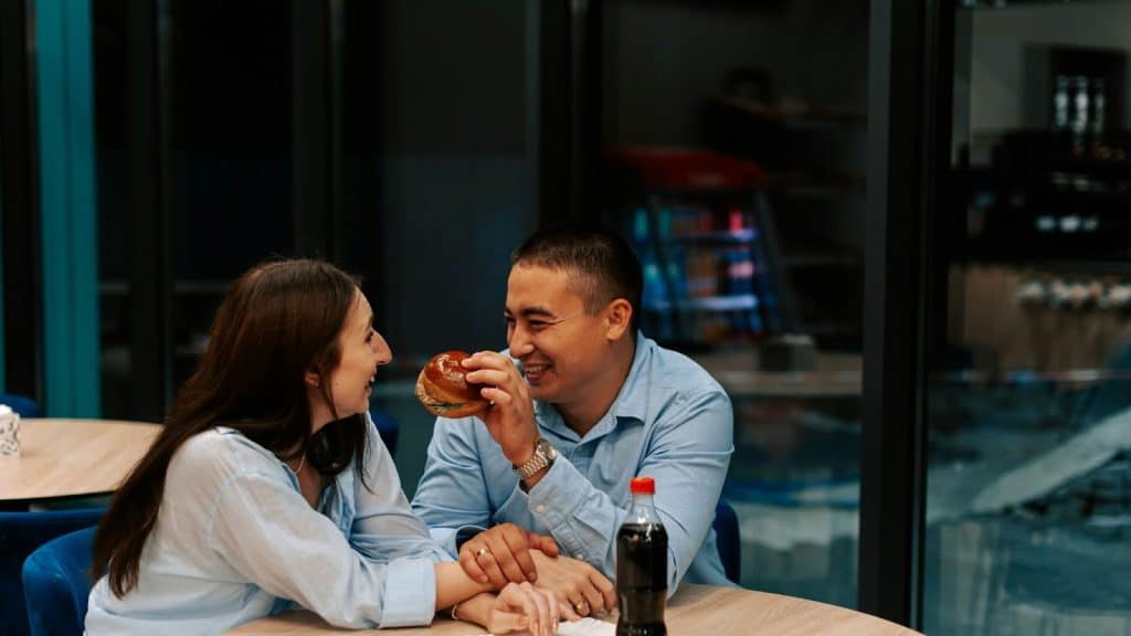 A man holding a burger 