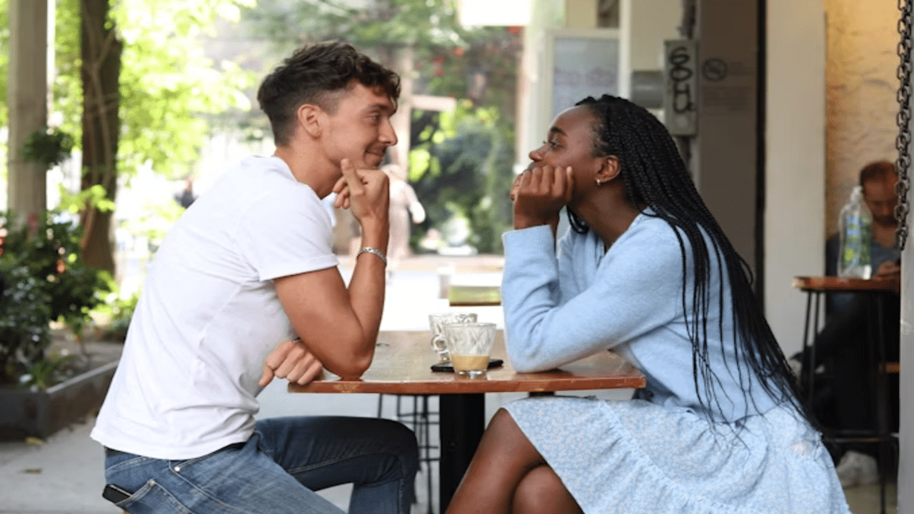A couple mirroring each other on a date