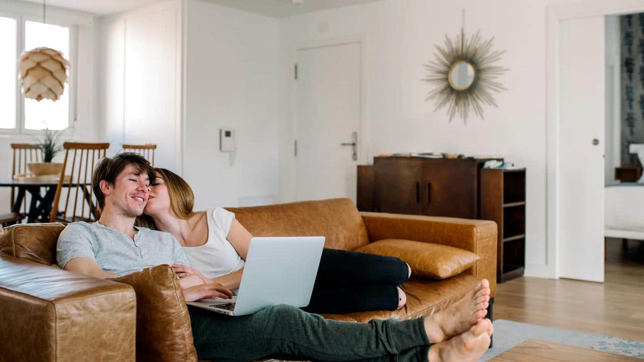 A couple relaxing on a couch