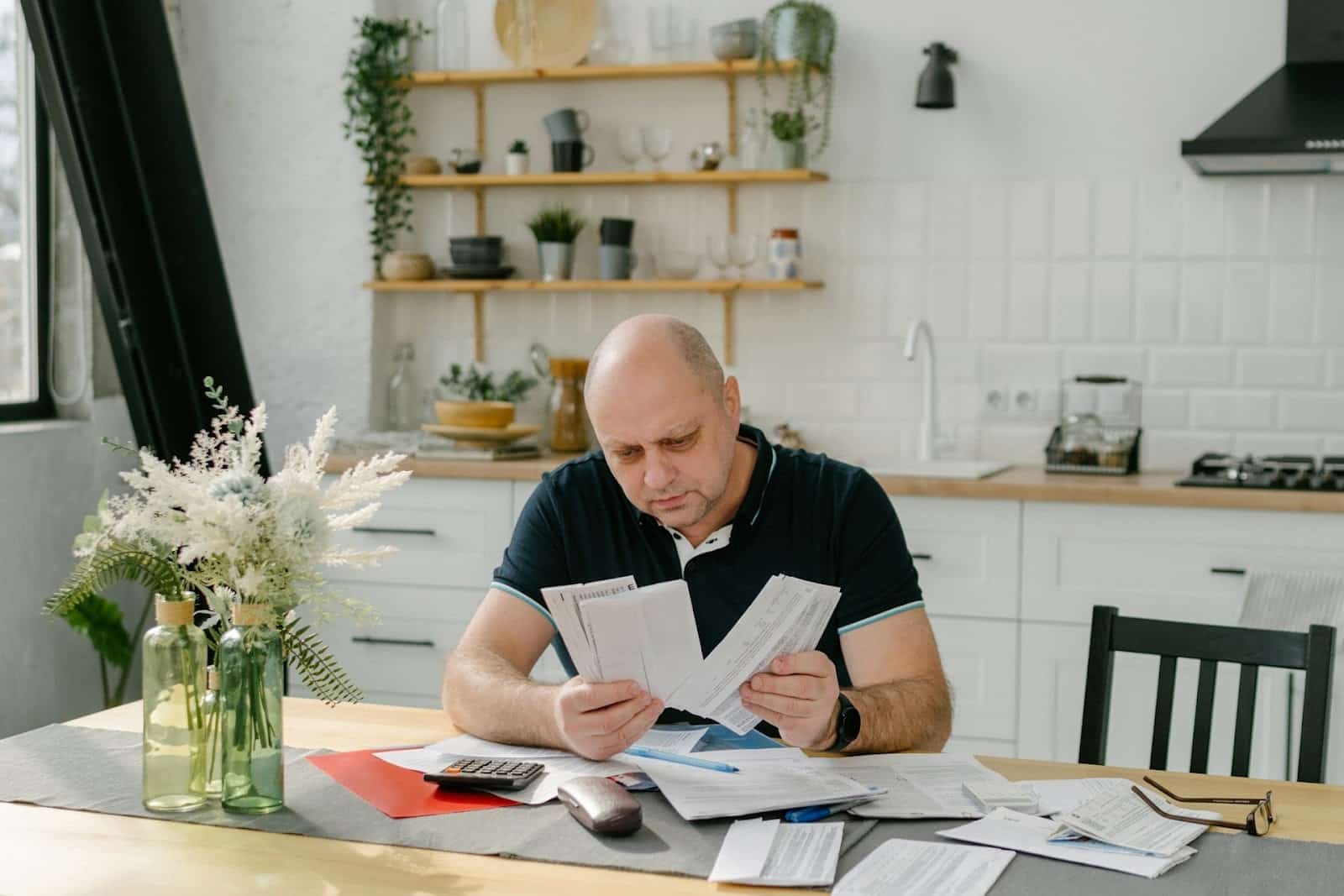man reviewing bills