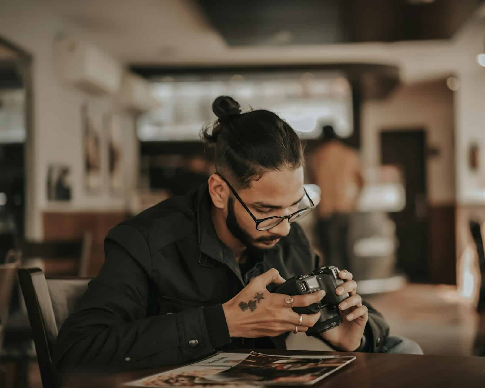 man looking old photos