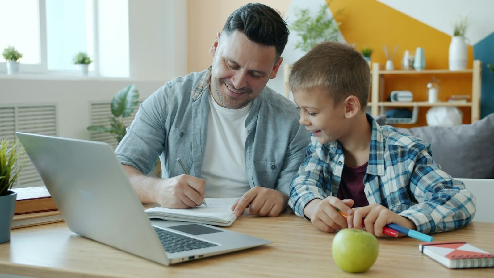 father helping child with homework