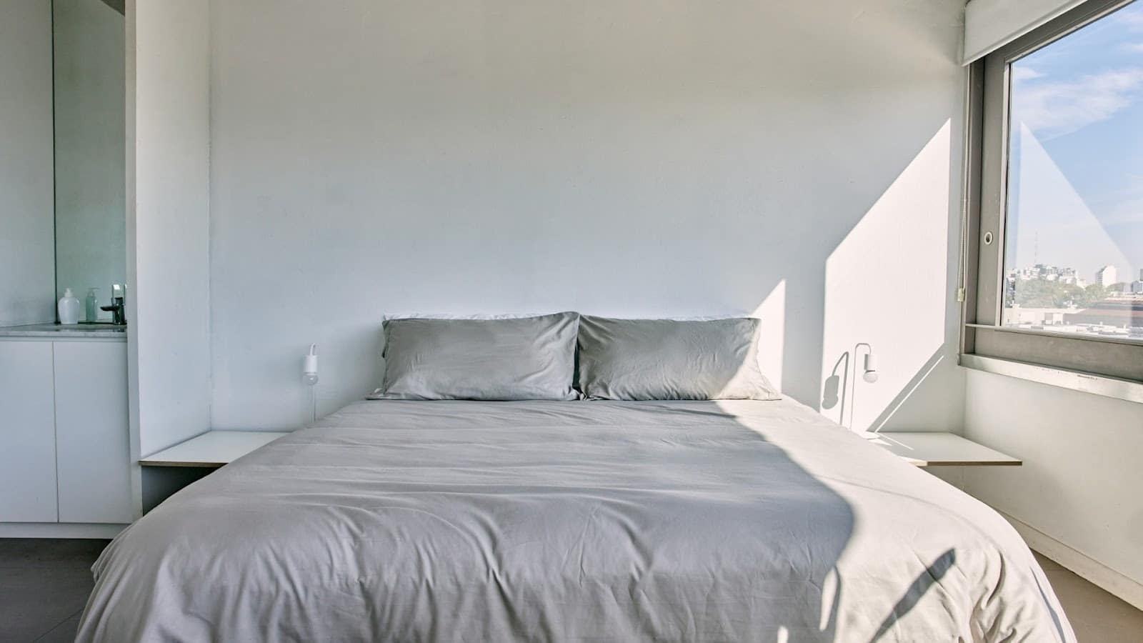 empty bedroom with unmade bed