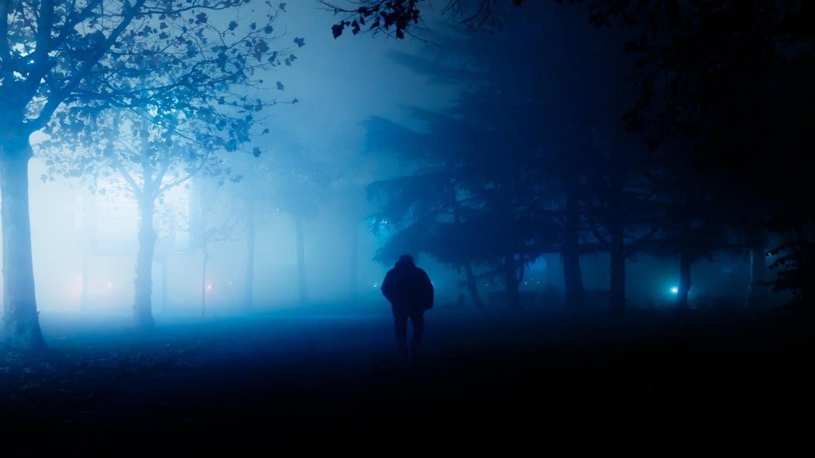 man walking alone at night