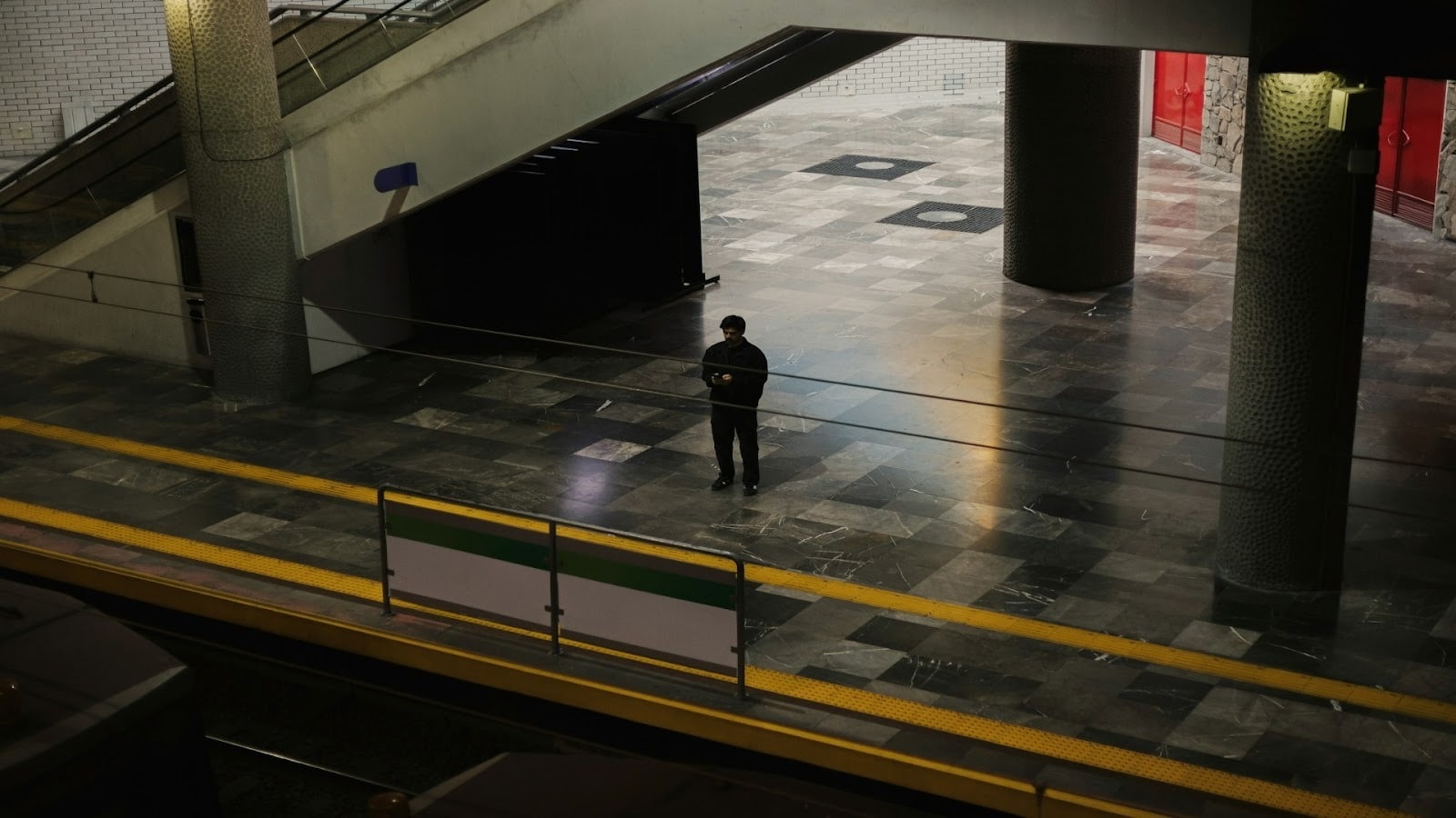 man standing alone in city