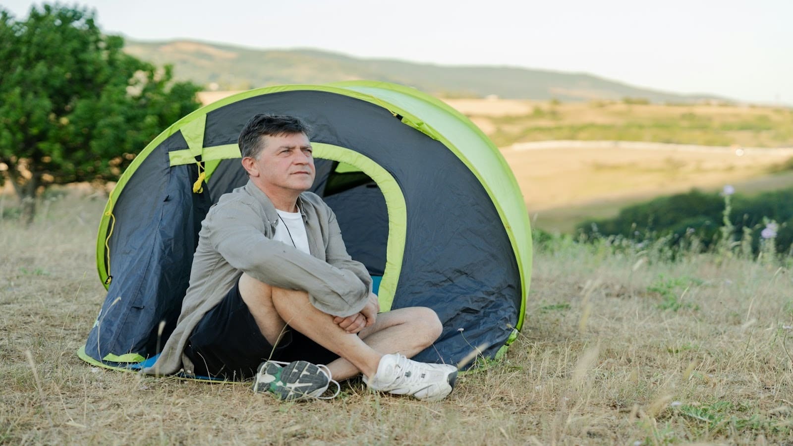 man sitting alone outdoors