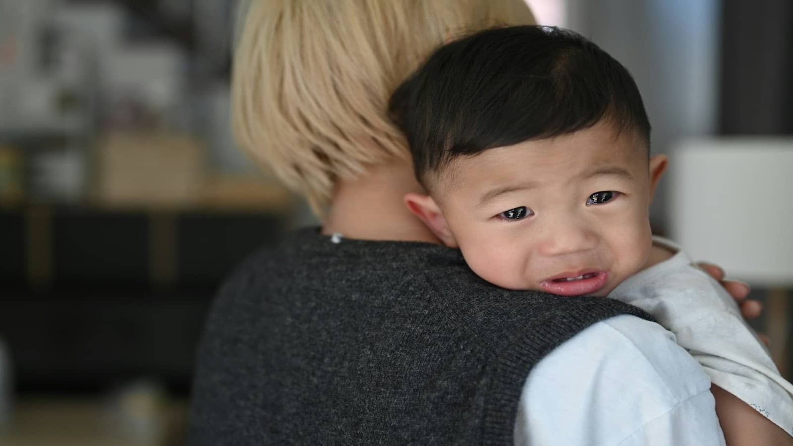 parent comforting young child