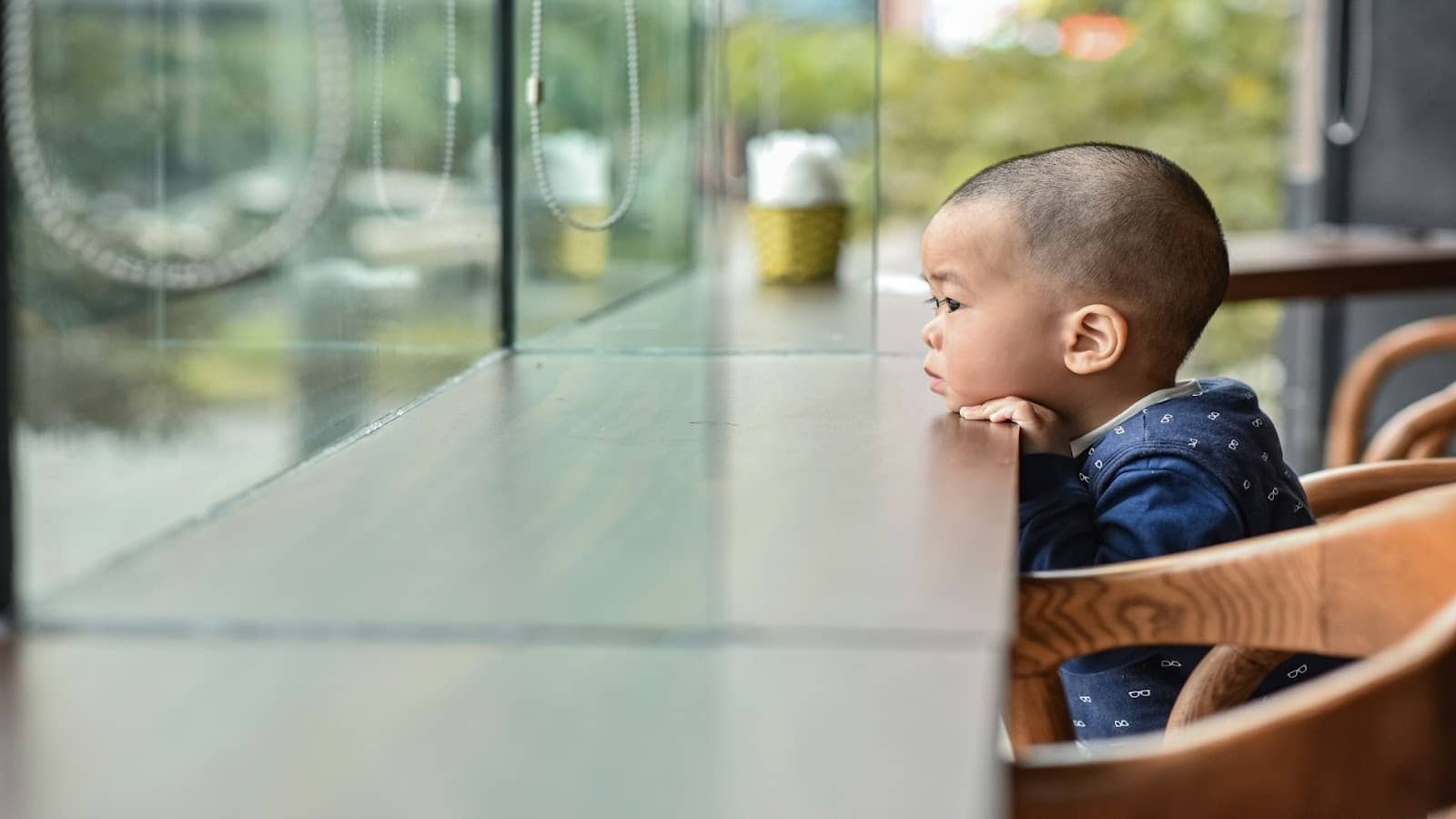 child sitting quietly alone