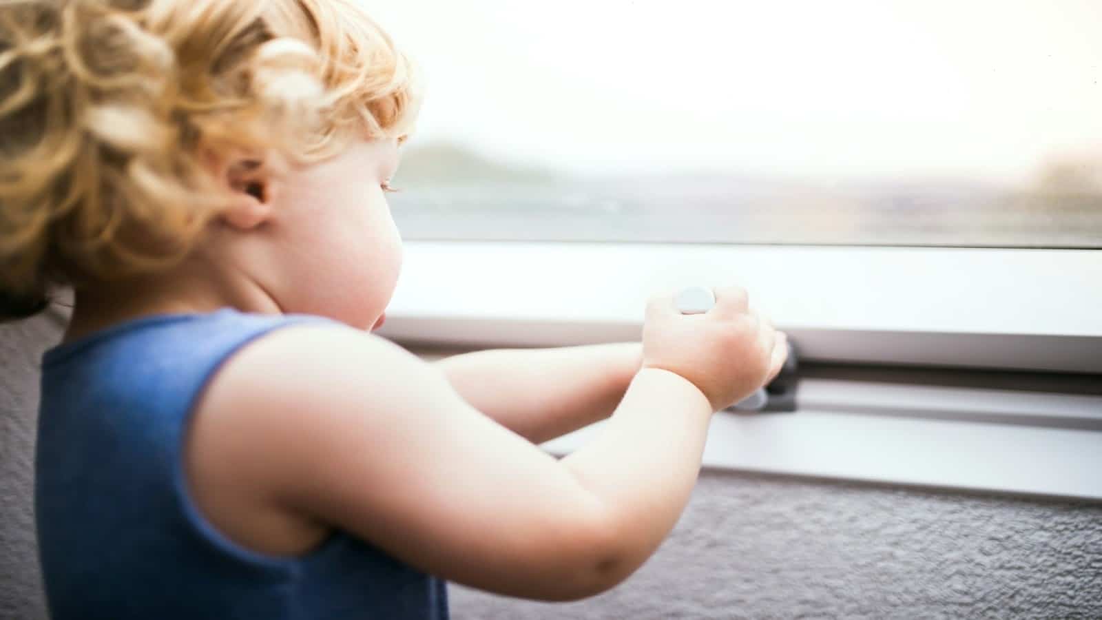 child looking worried at doorway