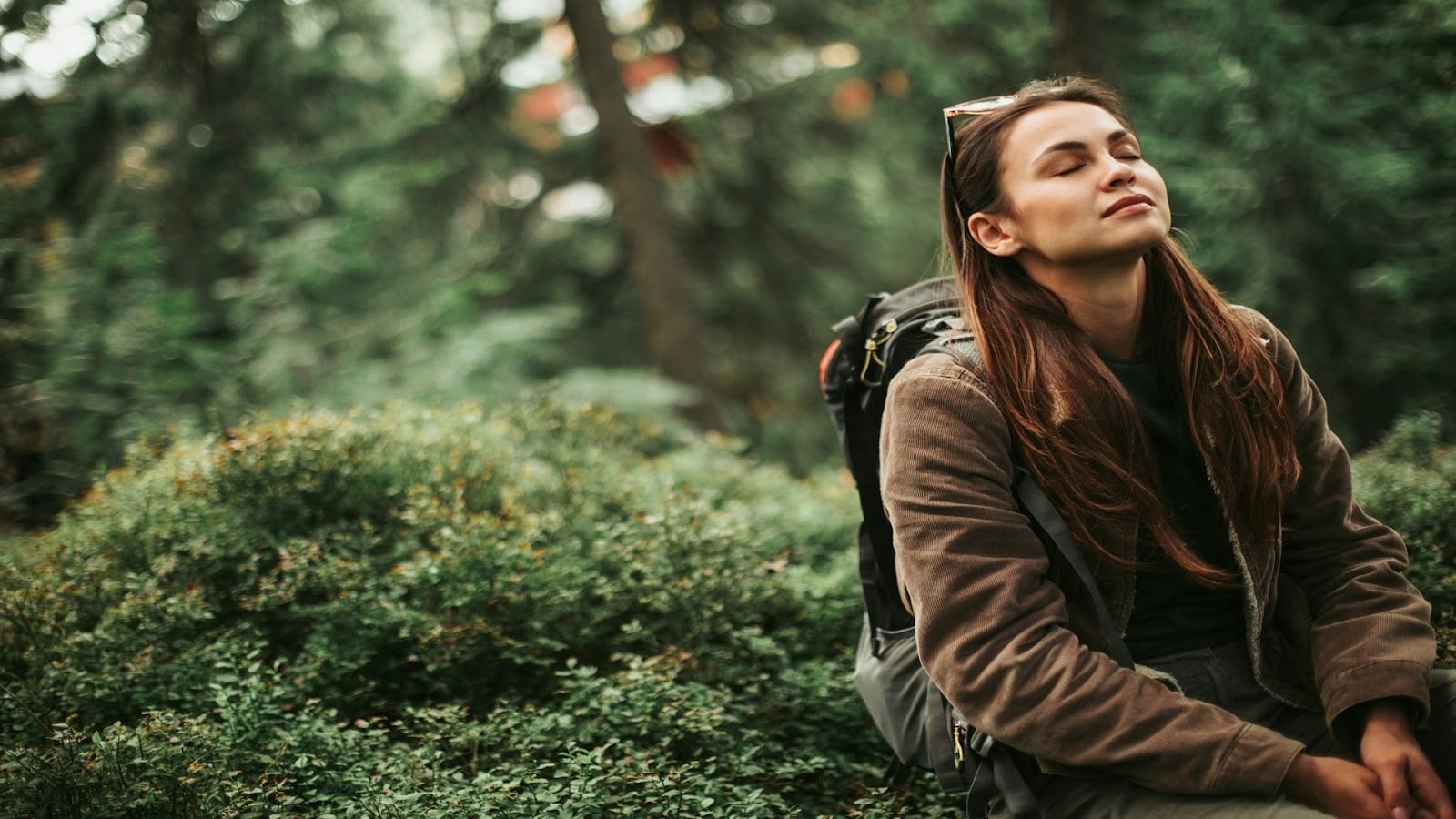 adult taking deep breath indoors